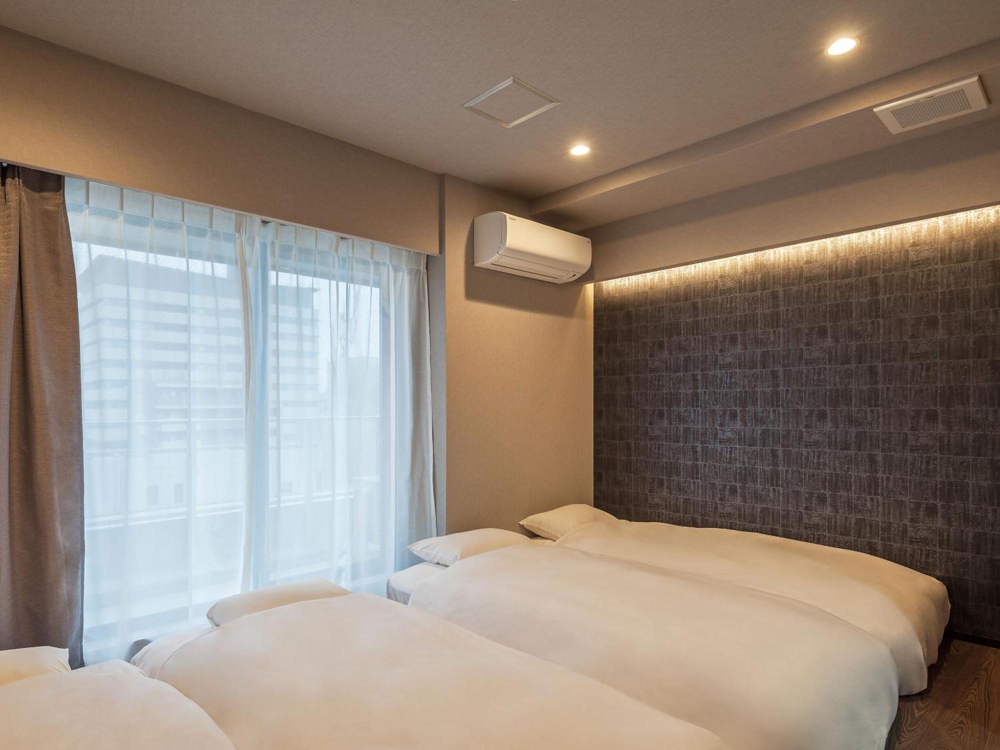 Chambre Quadruple avec Salle de Bains Privative