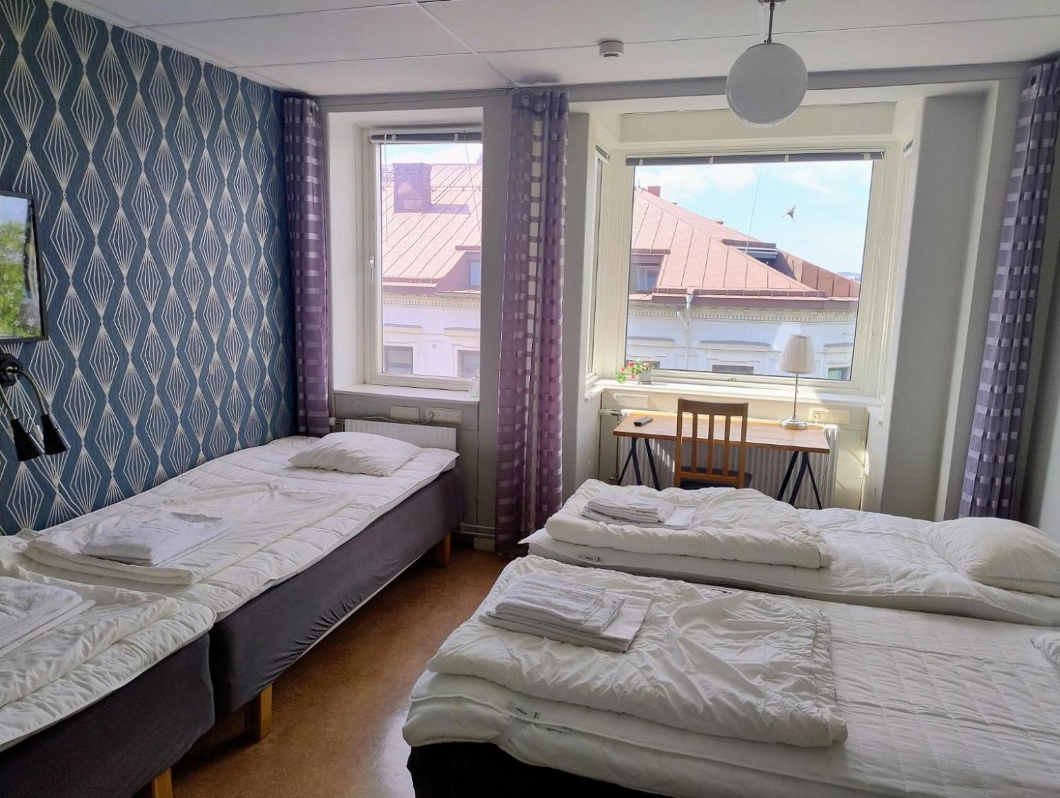 Chambre Quadruple avec Salle de Bains Commune